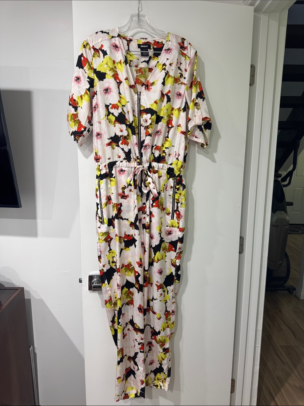 DKNY White Floral Zip-Front jumpsuit lime, black, orange and white  accents 
B15